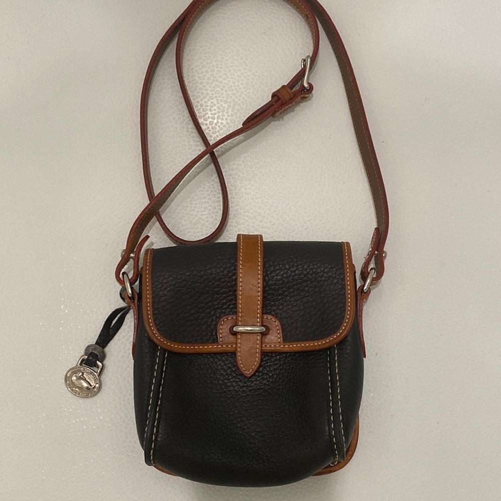 Dooney & Burke Black Crossover Mini Flap. Slightly stain strap.